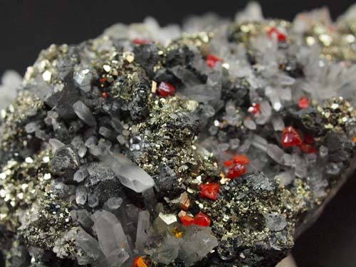 Quartz crystals with realgar crystals on it and pyrite crystals on sphalerite and galena crystals.<br>Size 4cm x 9cm x 3,5cm