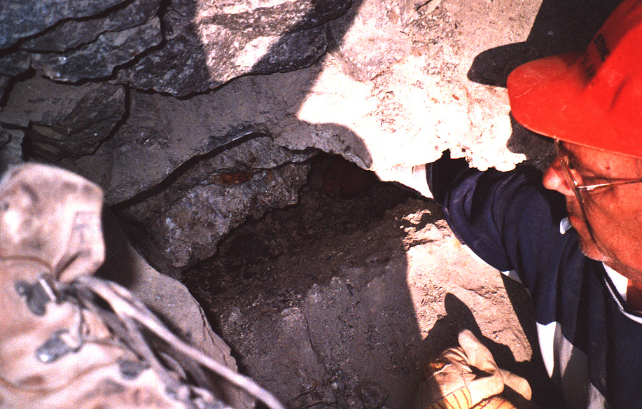 My dad with is hand inside that pegmatite