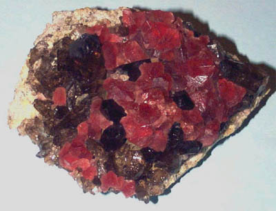 Red fluorite on smokey quartz