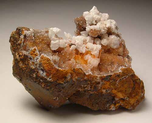 Wulfenite with calcite on quartz