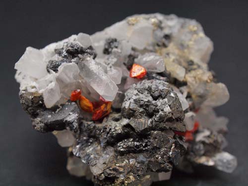 Quartz crystals with realgar crystals on it and sphalerite crystals (sphalerite crystal 1,5x1 cm).<br>Size 3cm x 4cm x 3cm